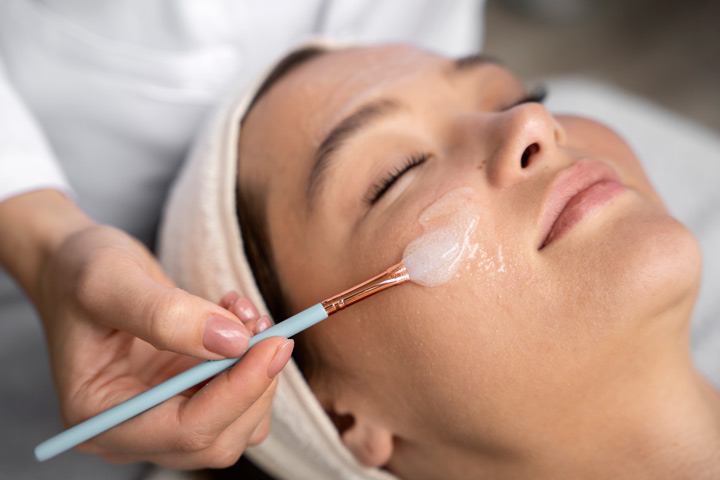 woman getting chemical peel at spa